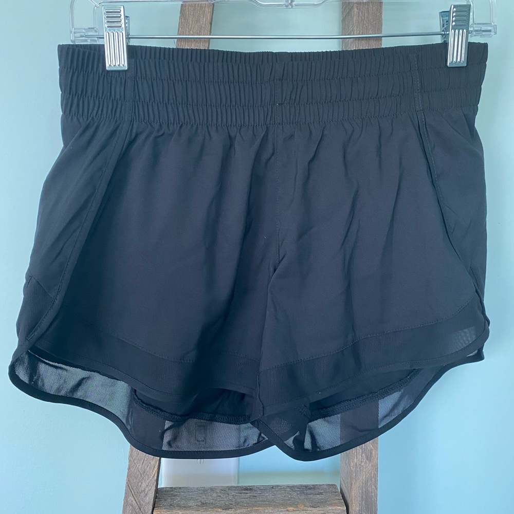 NWOT XS Black Athleta running short. Zip pocket, small inside pocket.